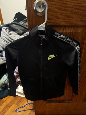 Nike Kids Black Jacket with Neon Yellow Logo and Branded Sleeve Tape